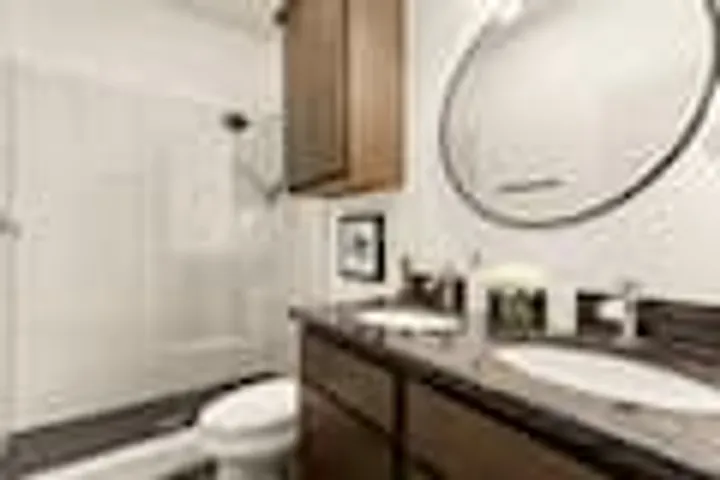 Bathroom with round mirror