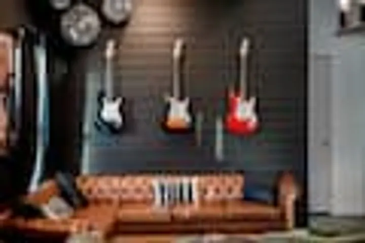 Lounge wall with three electric guitars