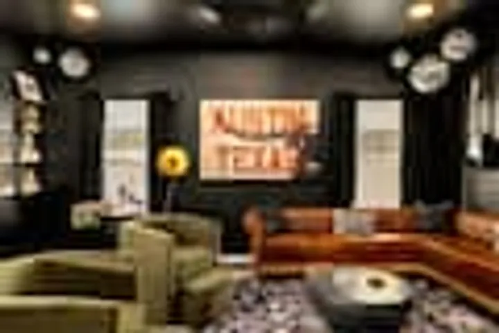 Velvet chairs and leather sofa in the lounge